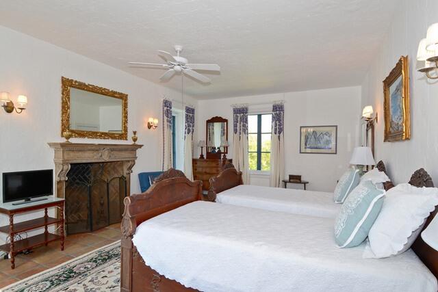 80 Middle Road Palm Beach, FL 33480 - Photo 27 of 33 a bed room with a bed and a fireplace