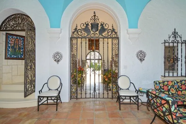 a view of a livingroom with furniture and a fan
