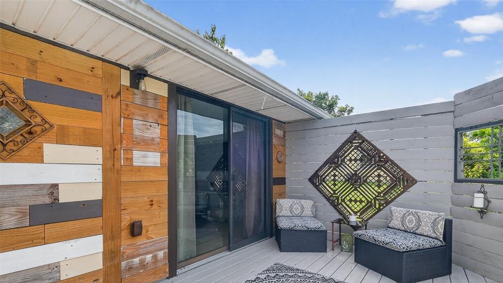 6499 Nebula Street Weeki Wachee, FL 34613 - Photo 11 of 54 a front view of a house with outdoor seating