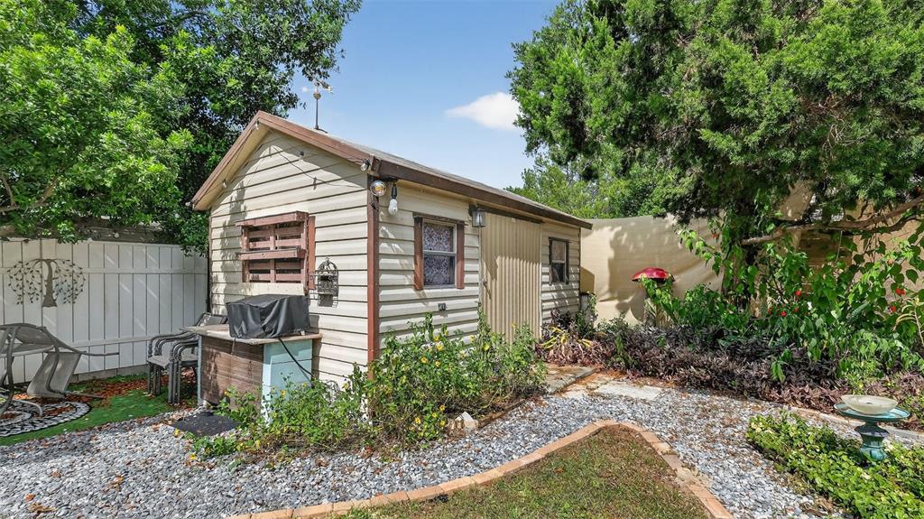 6499 Nebula Street Weeki Wachee, FL 34613 - Photo 16 of 54 a backyard of a house with lots of green space