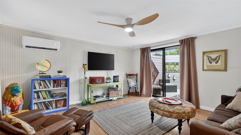 6499 Nebula Street Weeki Wachee, FL 34613 - Photo 19 of 54 a living room with furniture and a flat screen tv