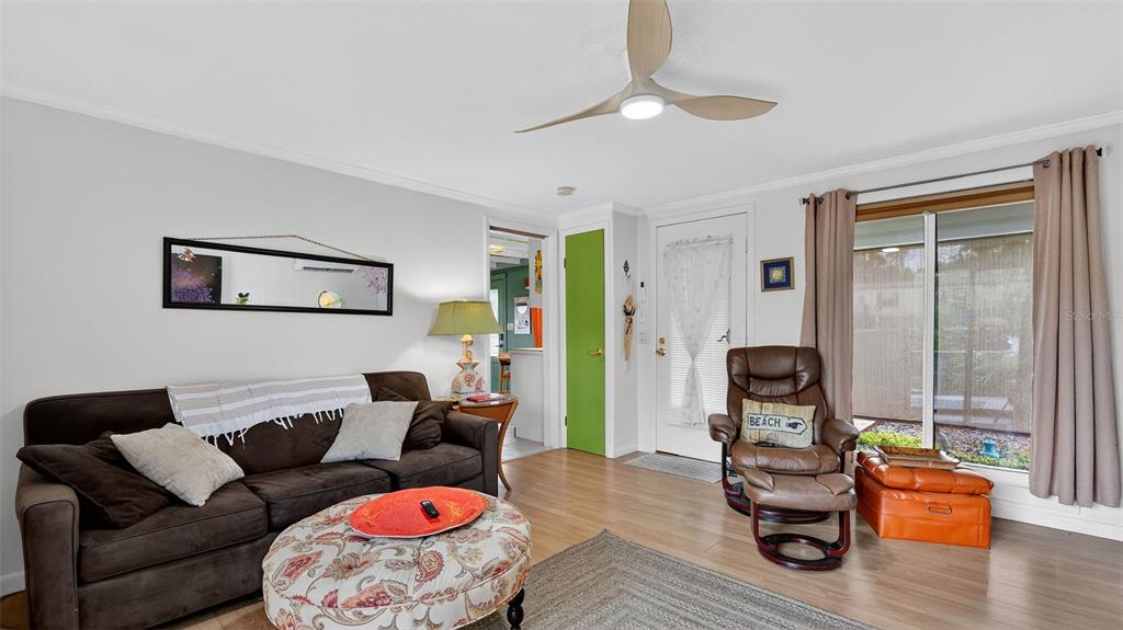 6499 Nebula Street Weeki Wachee, FL 34613 - Photo 20 of 54 a living room with furniture and wooden floor