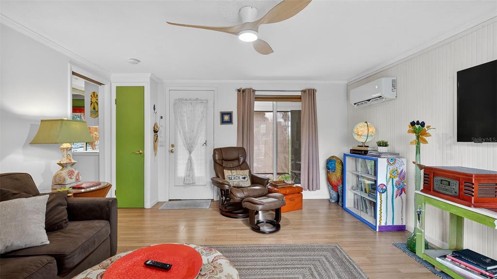 6499 Nebula Street Weeki Wachee, FL 34613 - Photo 21 of 54 a living room with furniture and a flat screen tv