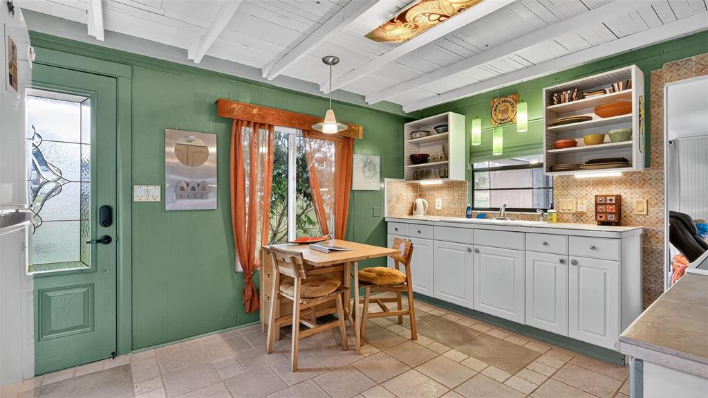 6499 Nebula Street Weeki Wachee, FL 34613 - Photo 22 of 54 a kitchen with stainless steel appliances a sink cabinets and a window