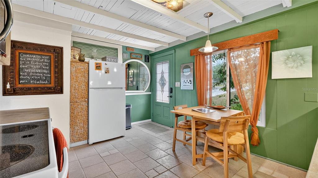 6499 Nebula Street Weeki Wachee, FL 34613 - Photo 23 of 54 a view of a dining room with furniture window and outside view