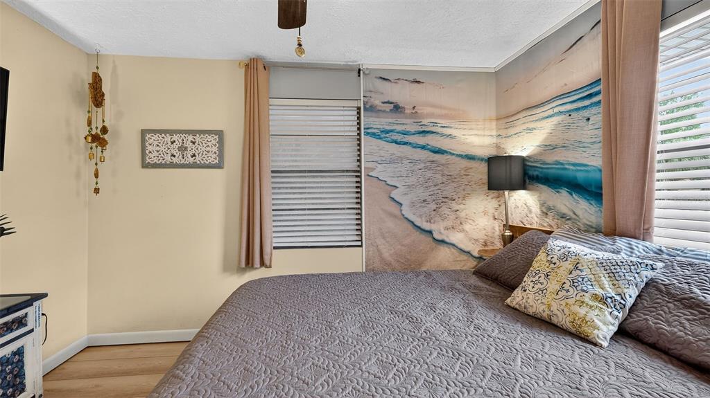 6499 Nebula Street Weeki Wachee, FL 34613 - Photo 25 of 54 a view of a bedroom with furniture and window