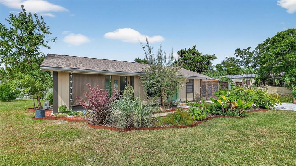 6499 Nebula Street Weeki Wachee, FL 34613 - Photo 27 of 54 front view of a house with a yard