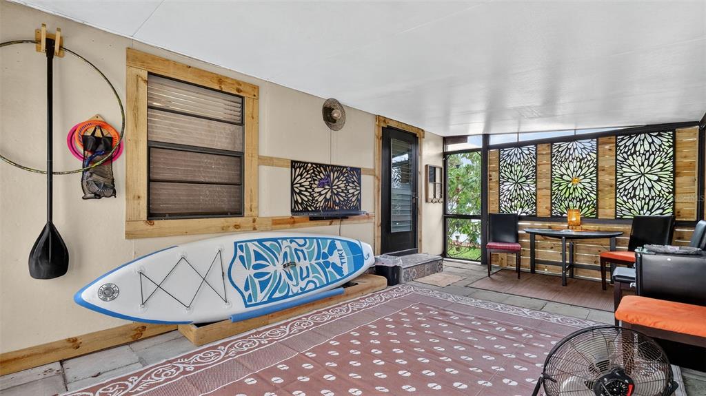 6499 Nebula Street Weeki Wachee, FL 34613 - Photo 30 of 54 a living room with furniture and a window