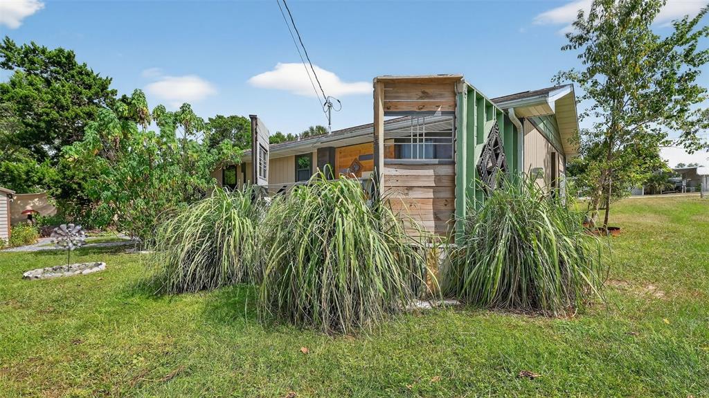6499 Nebula Street Weeki Wachee, FL 34613 - Photo 33 of 54 a front view of a house with a yard