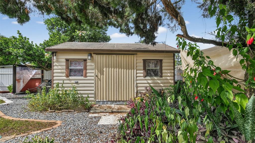 6499 Nebula Street Weeki Wachee, FL 34613 - Photo 37 of 54 a front view of a house with a yard