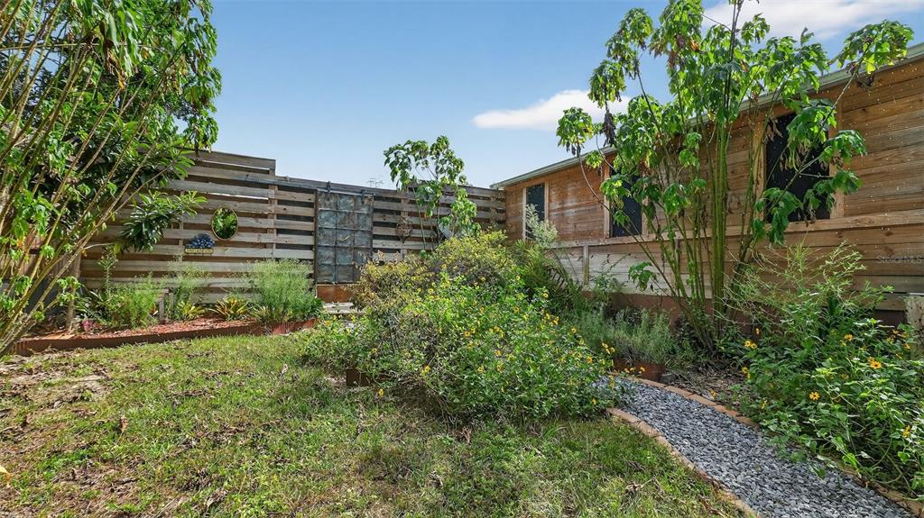 6499 Nebula Street Weeki Wachee, FL 34613 - Photo 38 of 54 a view of a house with a yard and plants