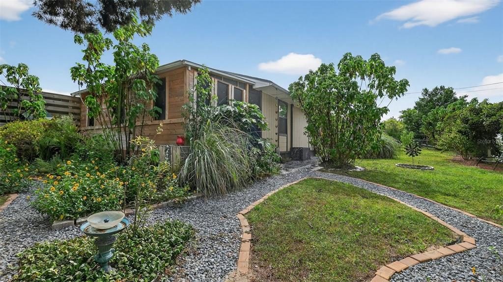 6499 Nebula Street Weeki Wachee, FL 34613 - Photo 41 of 54 a view of a garden with a fountain