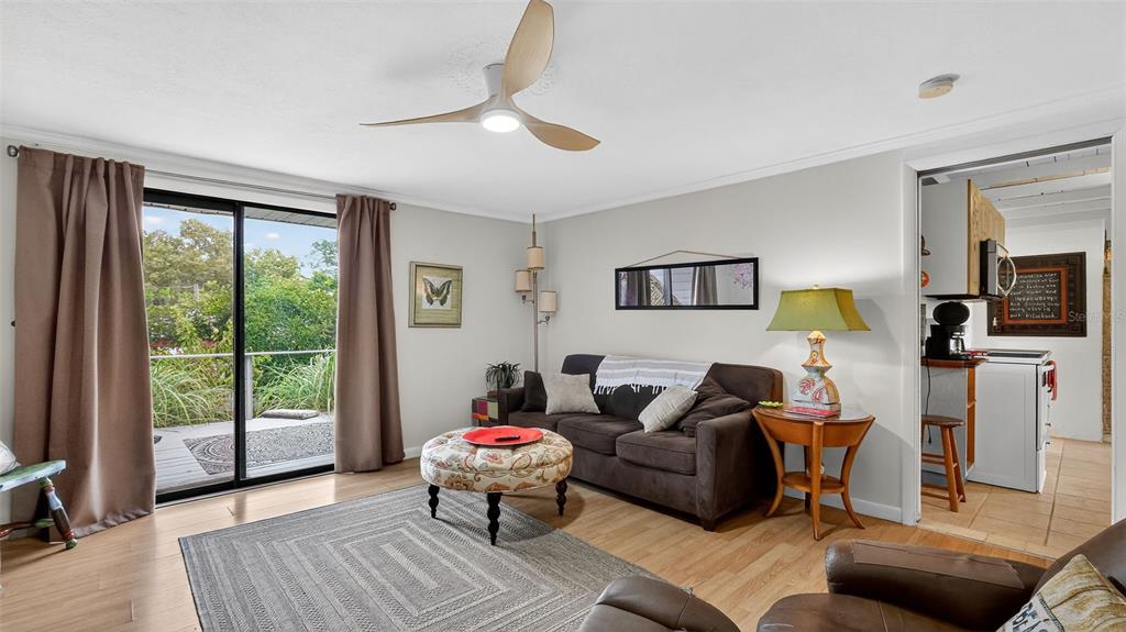 6499 Nebula Street Weeki Wachee, FL 34613 - Photo 6 of 54 a living room with furniture and a window