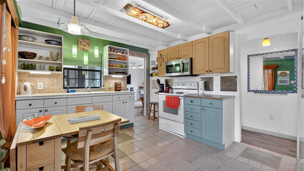 6499 Nebula Street Weeki Wachee, FL 34613 - Photo 7 of 54 a kitchen that has a stove and a microwave