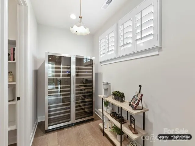 a view of a livingroom with furniture and stairs