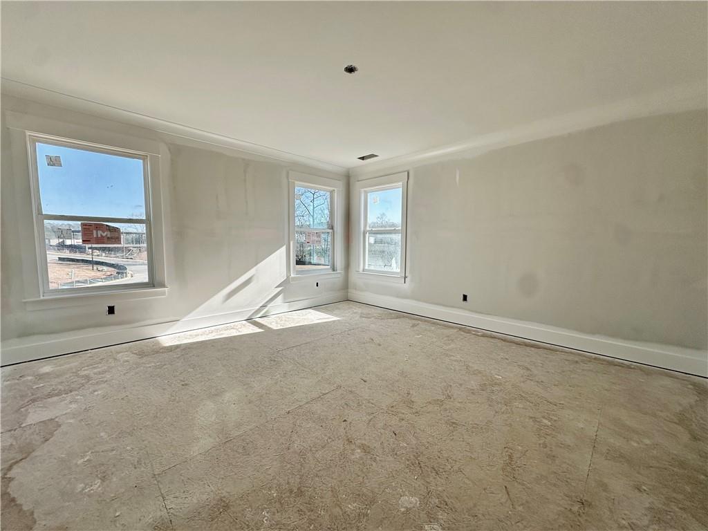 162 Marble Tree Way Ball Ground, GA 30107 - Photo 14 of 38 a view of an empty room with a window