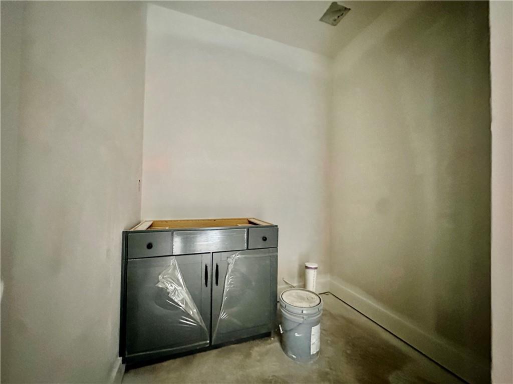 162 Marble Tree Way Ball Ground, GA 30107 - Photo 4 of 38 a bathroom with a toilet and a shower