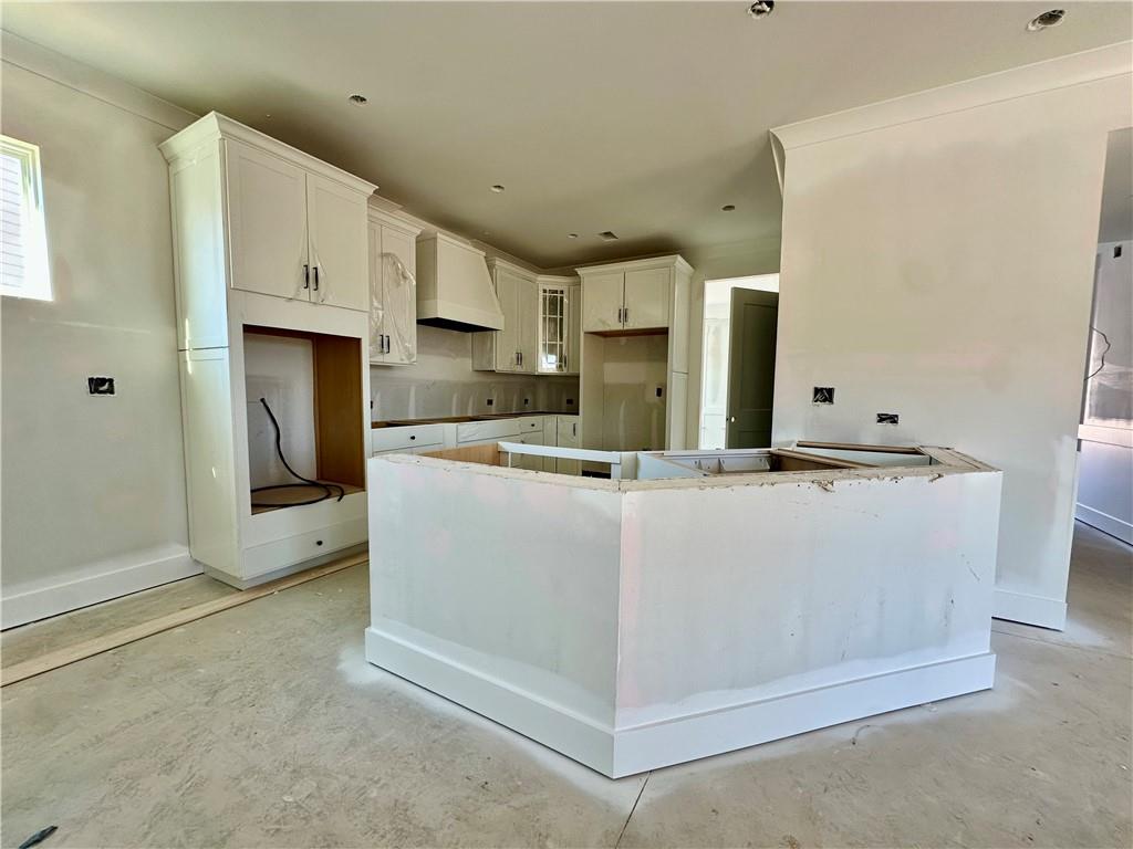 162 Marble Tree Way Ball Ground, GA 30107 - Photo 7 of 38 a view of kitchen with stainless steel appliances granite countertop refrigerator sink and cabinets