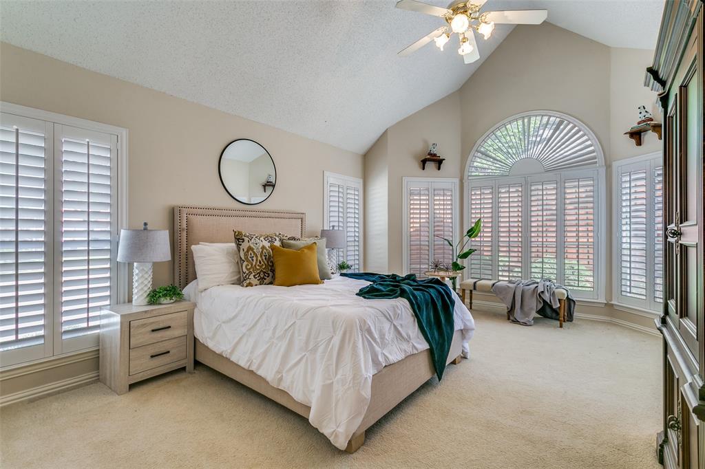 14596 Blueberry Court Addison, TX 75001 - Photo 18 of 32 Bedroom featuring light carpet and a ceiling fan