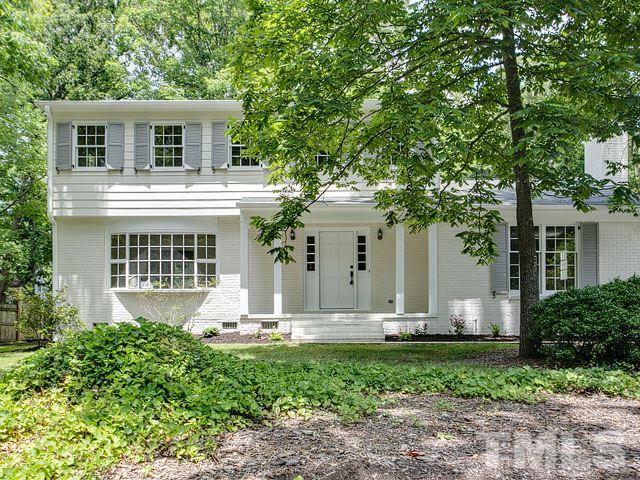 1937 Fountain Ridge Road Chapel Hill, NC 27517 - Photo 1 of 24 a front view of a house with garden