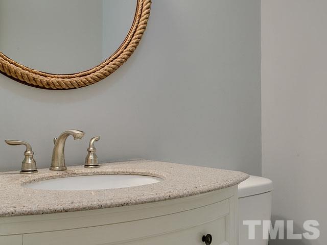1937 Fountain Ridge Road Chapel Hill, NC 27517 - Photo 14 of 24 a bathroom with a granite countertop sink and mirror