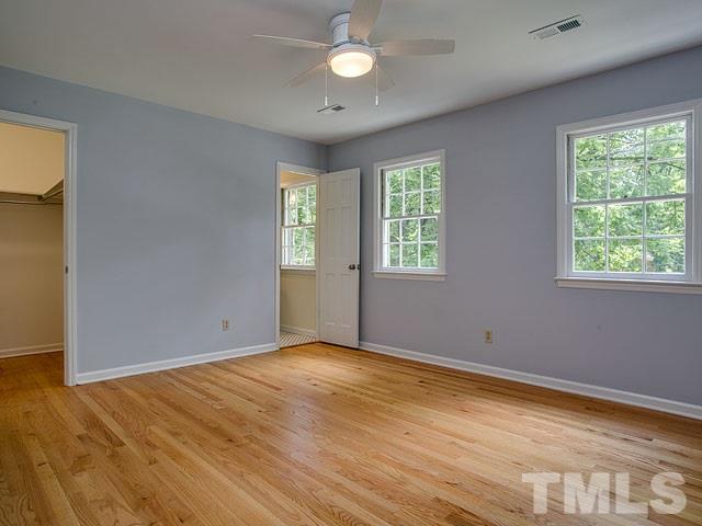 1937 Fountain Ridge Road Chapel Hill, NC 27517 - Photo 18 of 24 a view of an empty room with wooden floor and a window