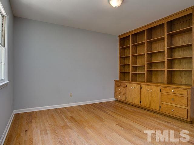 1937 Fountain Ridge Road Chapel Hill, NC 27517 - Photo 21 of 24 a view of an empty room with closet and wooden floor