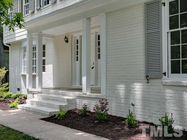 1937 Fountain Ridge Road Chapel Hill, NC 27517 - Photo 4 of 24 a front view of a house with a yard