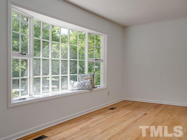 1937 Fountain Ridge Road Chapel Hill, NC 27517 - Photo 5 of 24 a view of empty room with wooden floor and fan