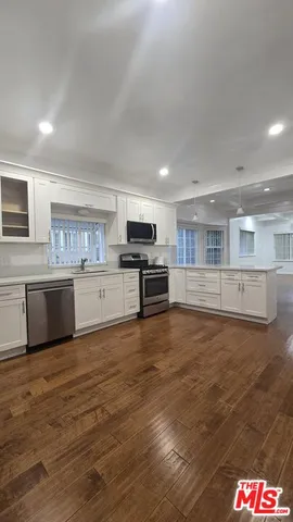 a view of kitchen with wooden floor