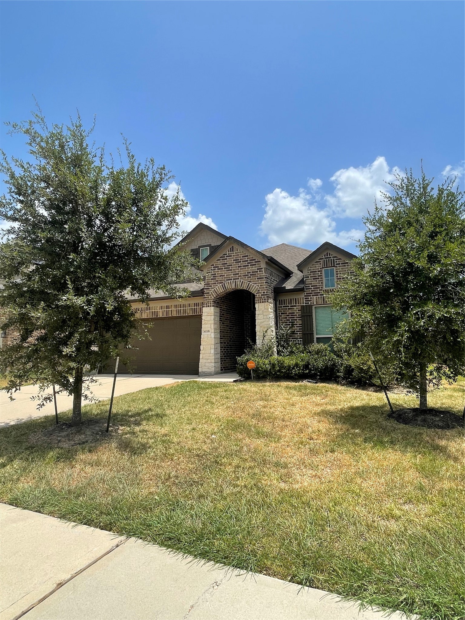 4118 Guild Meadows Drive Houston, TX 77084 - Photo 2 of 35 a front view of a house with a yard