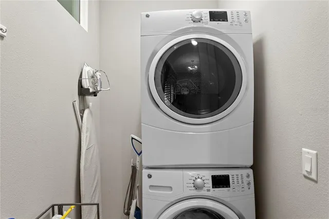 a bathroom with a granite countertop sink mirror and double
