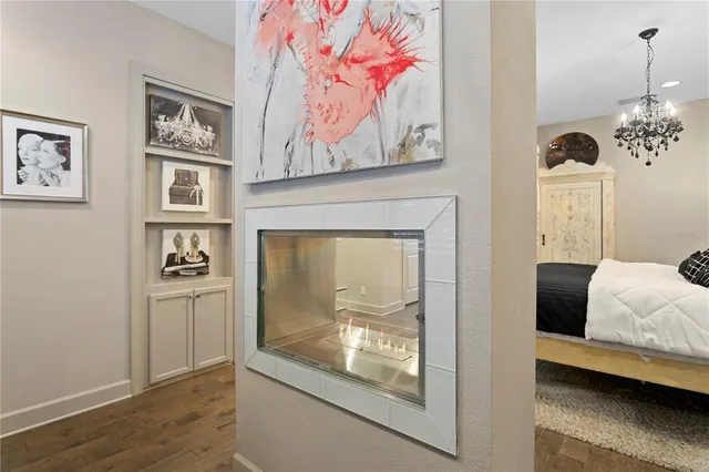 a bathroom with a bathtub and next to a window