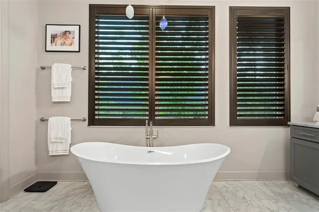 a large kitchen with a table and chairs