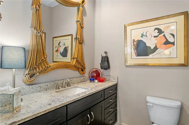 a view of a kitchen with cabinets and chair