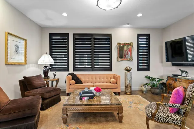 a kitchen with stainless steel appliances granite countertop a kitchen island a stove a table and chairs