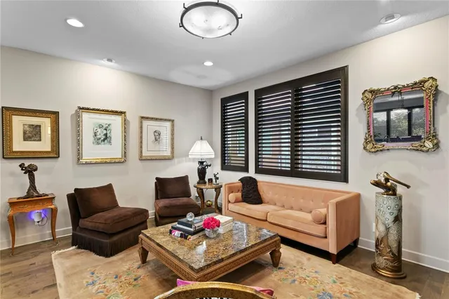 a large kitchen with kitchen island a stove a sink a dining table and chairs