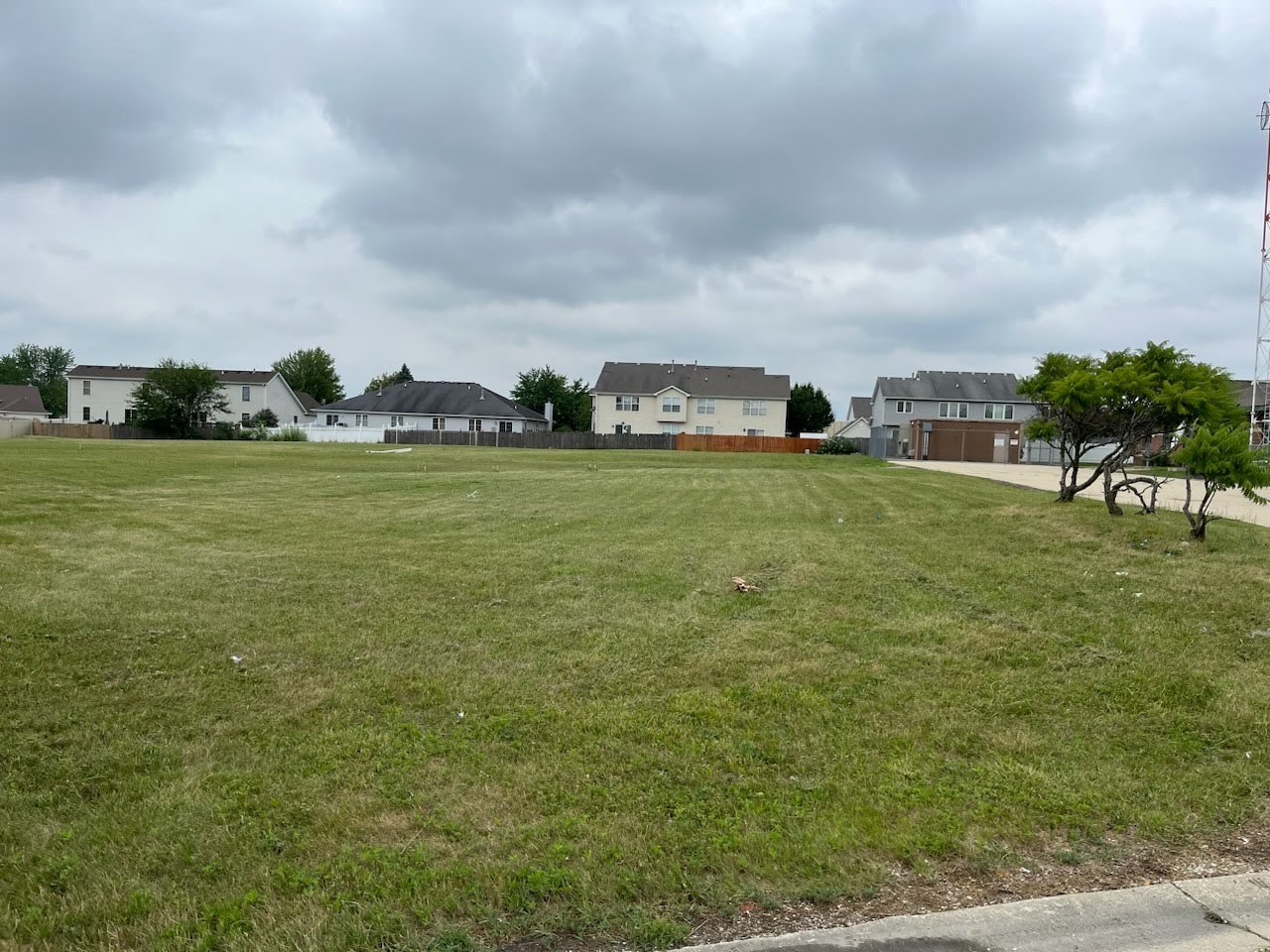 2385 Jorie Court Crest Hill, IL 60403 - Photo 2 of 4 a view of a big yard with an buildings and car parked