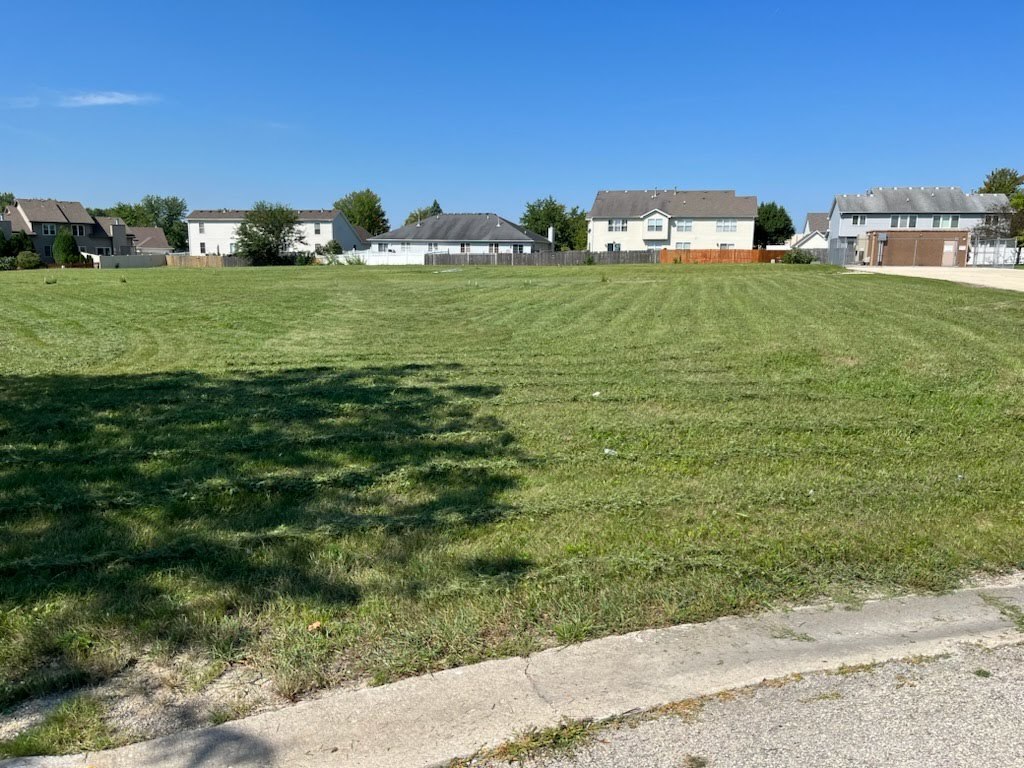 2385 Jorie Court Crest Hill, IL 60403 - Photo 3 of 4 a view of a big yard with a house in the background