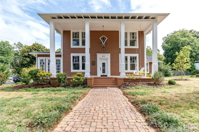 front view of a house with a yard