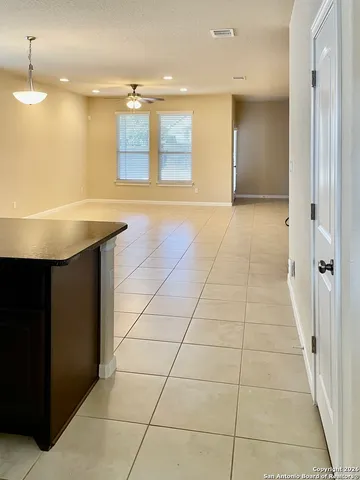 a view of a hallway with an empty room