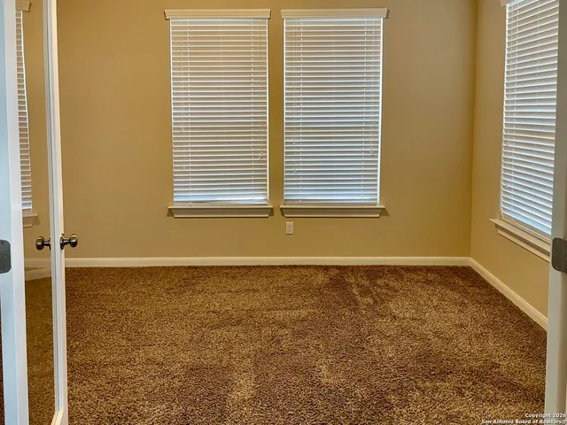 a view of a room that has a window in it