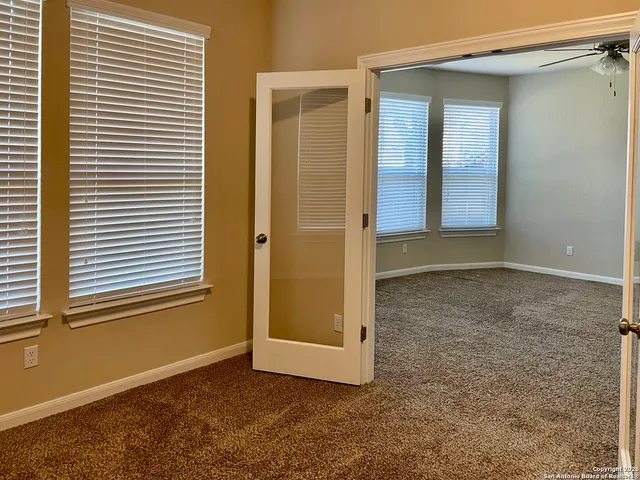 an empty room with windows