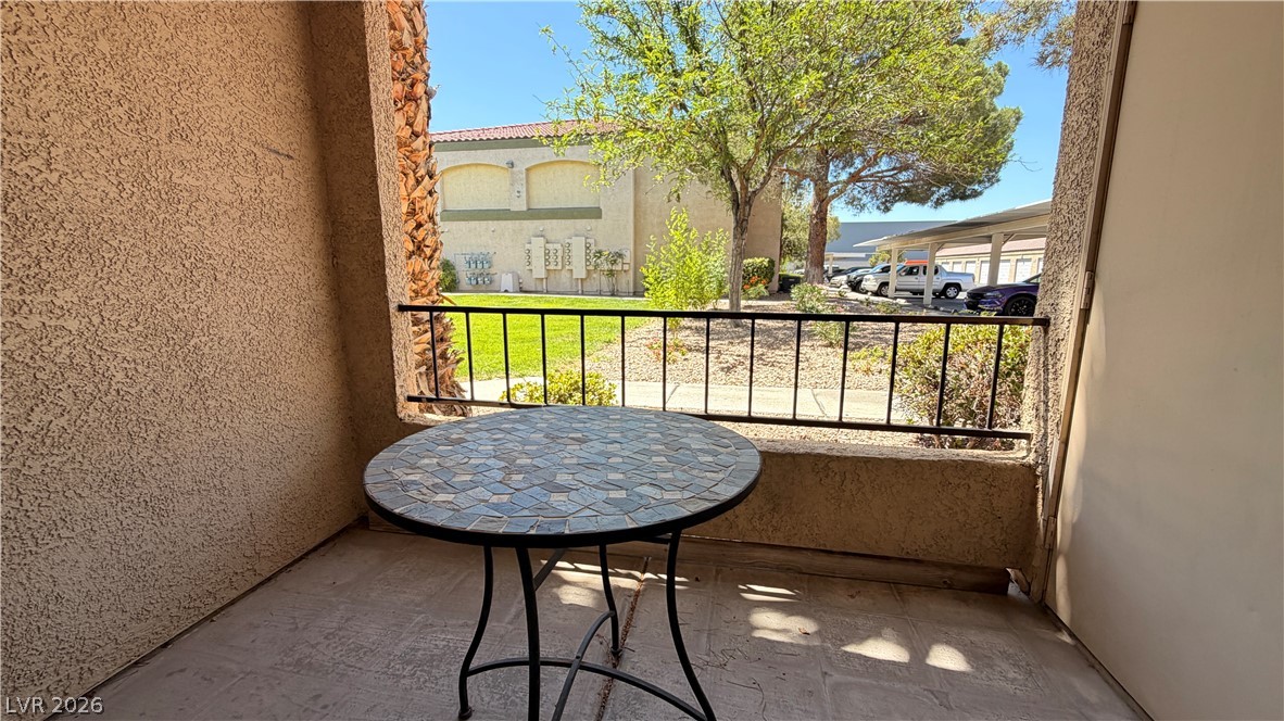 7885 West Flamingo Road, Unit 1131 Las Vegas, NV 89147 - Photo 10 of 36 A quaint patio offers a tranquil retreat overlooking a community greenspace.