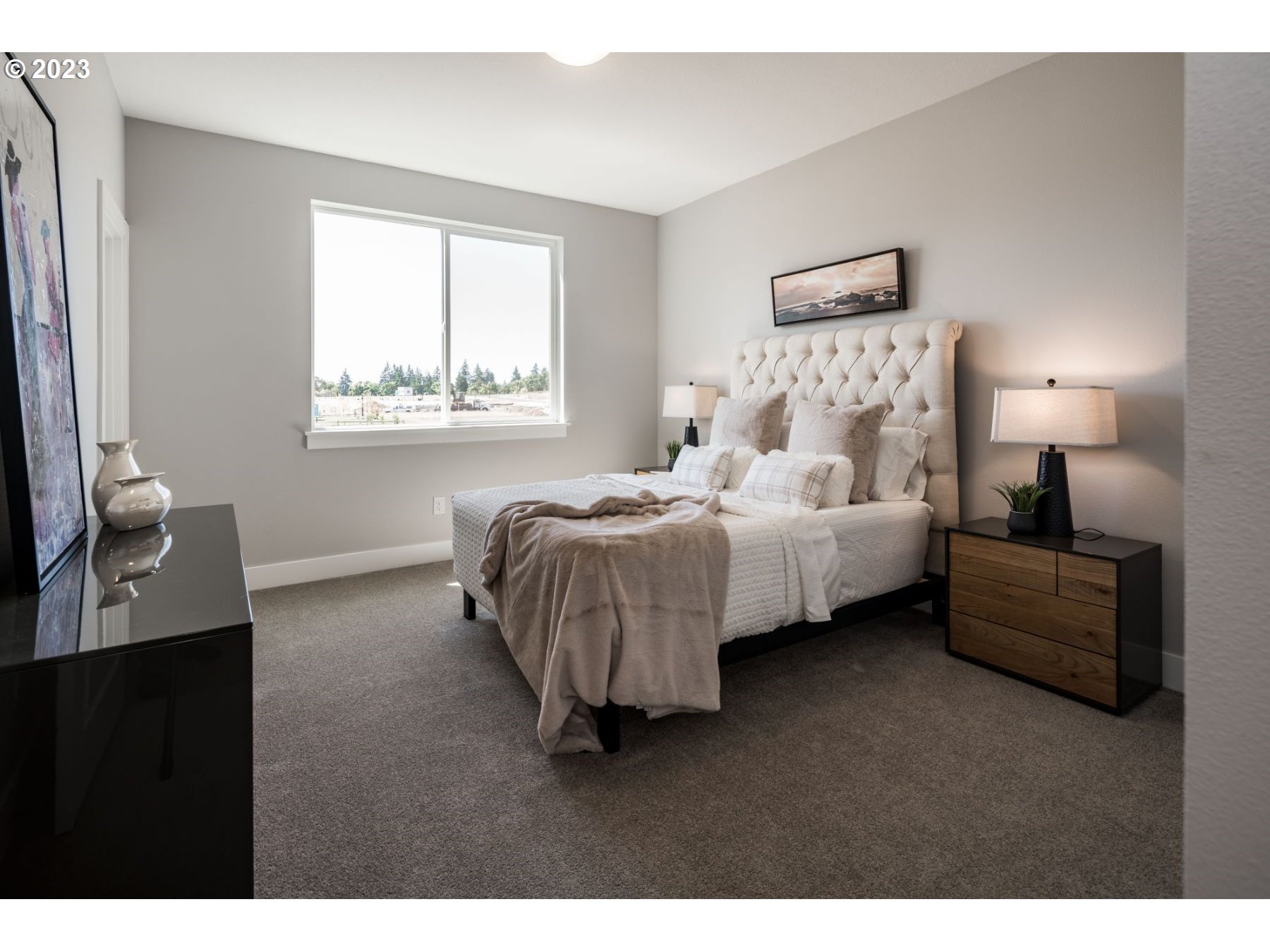 813 Northwest 178th Street Ridgefield, WA 98642 - Photo 11 of 21 a bed room with a bed window and a night stand
