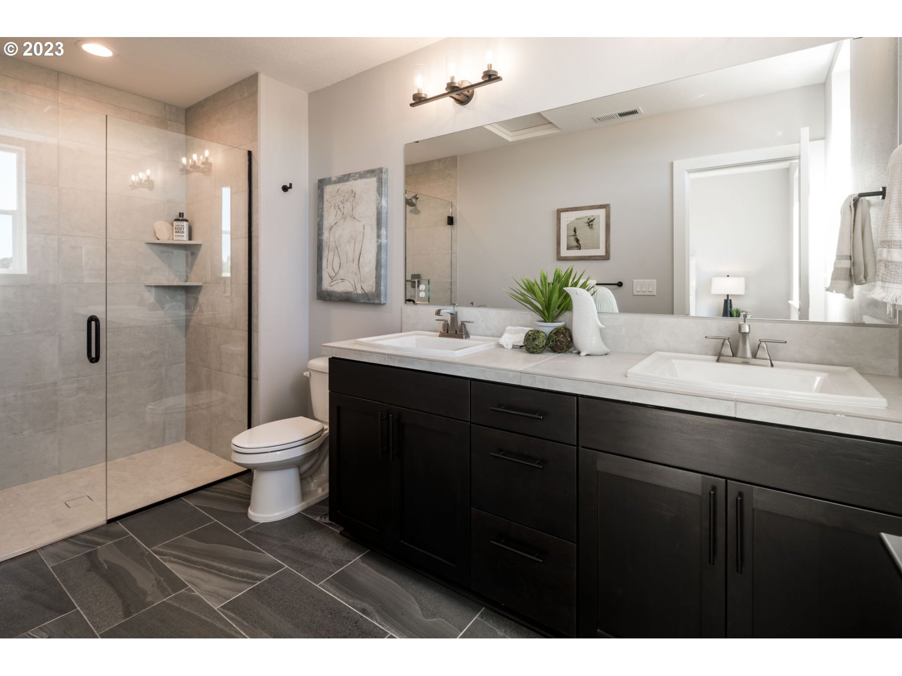 813 Northwest 178th Street Ridgefield, WA 98642 - Photo 14 of 21 a bathroom with a sink toilet and shower