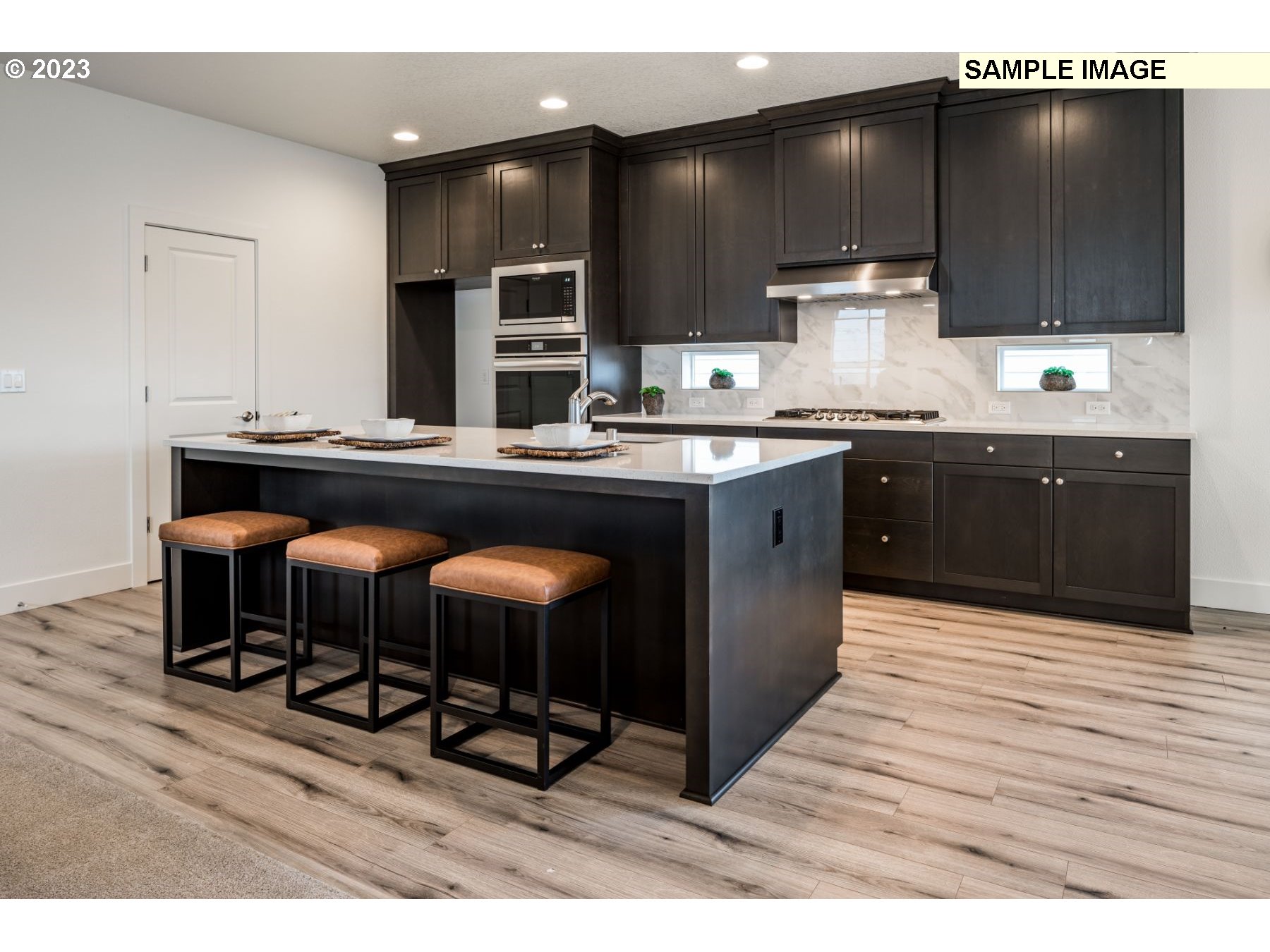 813 Northwest 178th Street Ridgefield, WA 98642 - Photo 5 of 21 a kitchen with stainless steel appliances a sink and cabinets