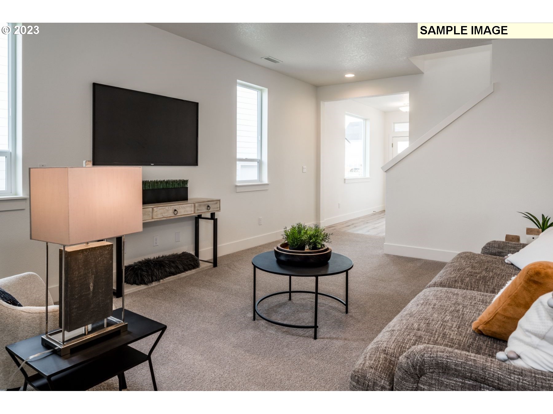 813 Northwest 178th Street Ridgefield, WA 98642 - Photo 6 of 21 a living room with furniture and a flat screen tv