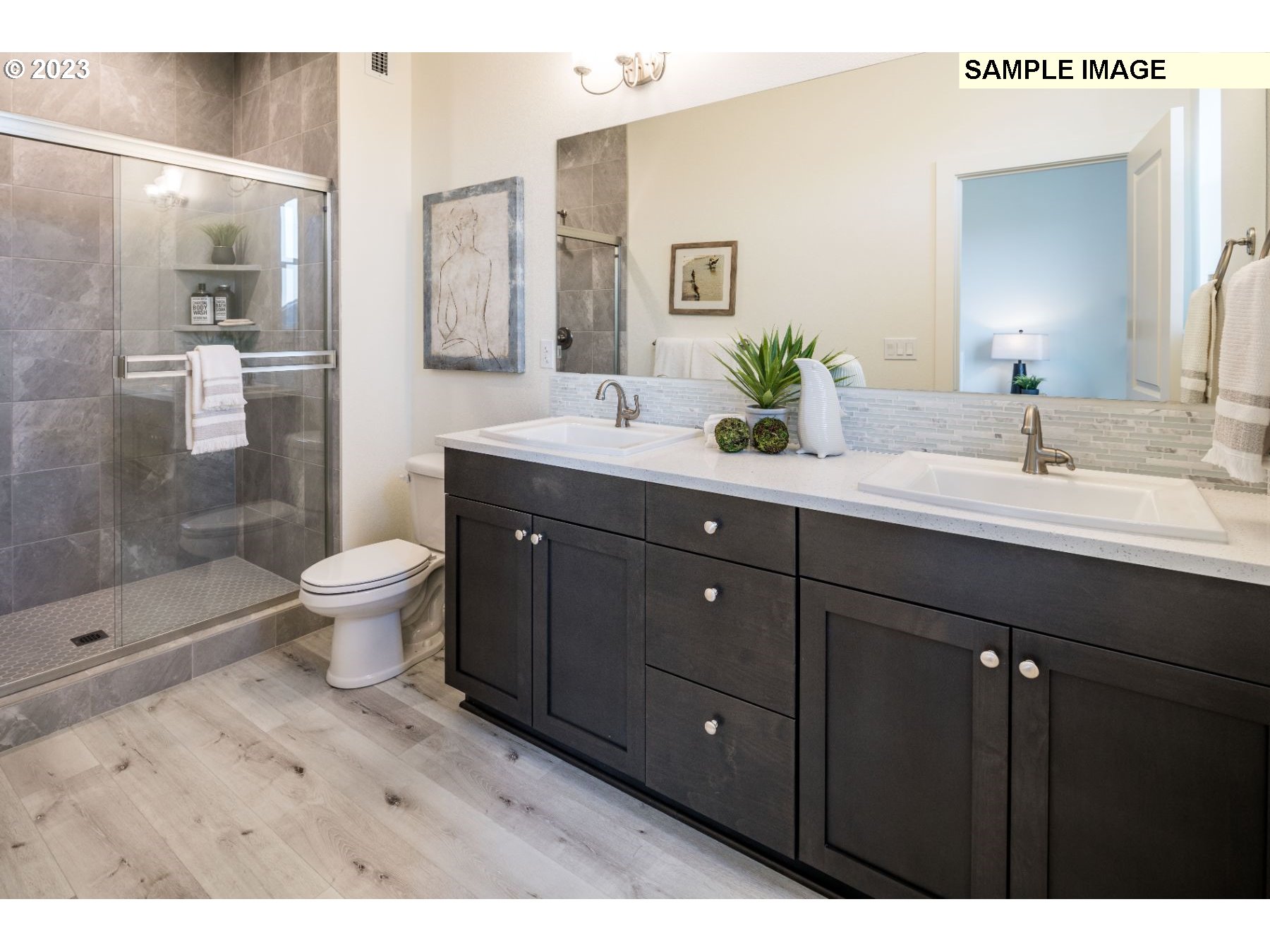 813 Northwest 178th Street Ridgefield, WA 98642 - Photo 8 of 21 a bathroom with a double vanity sink toilet and shower