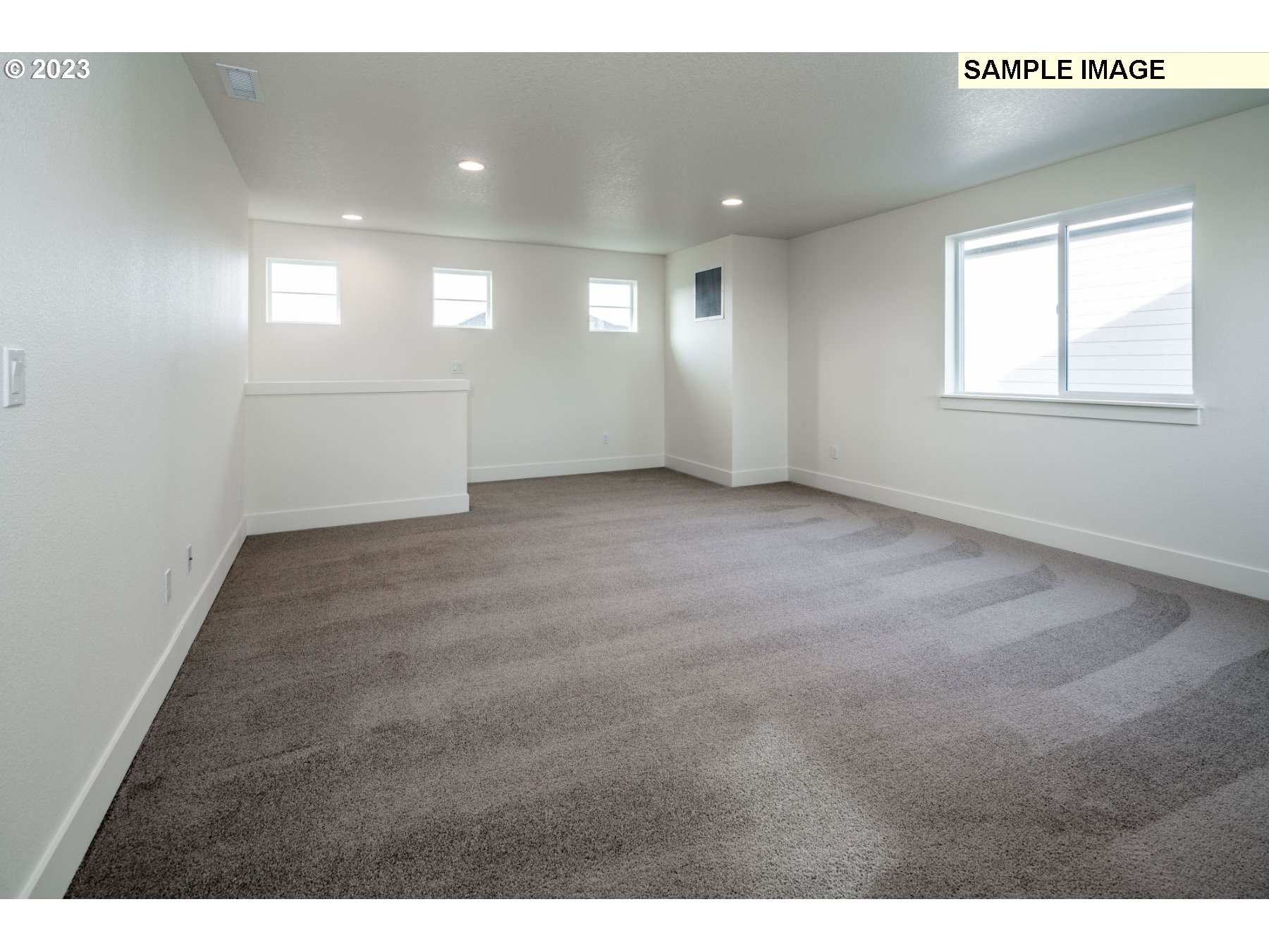 813 Northwest 178th Street Ridgefield, WA 98642 - Photo 9 of 21 a view of an empty room and a window